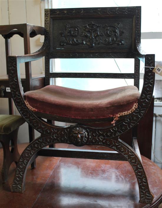 Carved oak X-frame chair